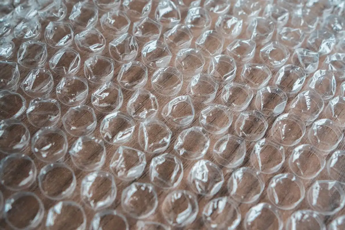 Close-up of bubble wrap with air-filled bubbles, suggesting insulation material