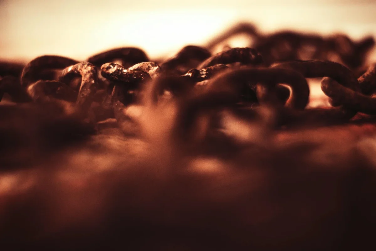 Close-up view of a metal garage door chain
