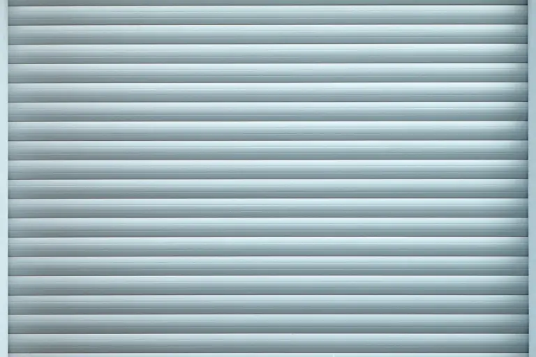 Grey garage door with evenly spaced horizontal slats