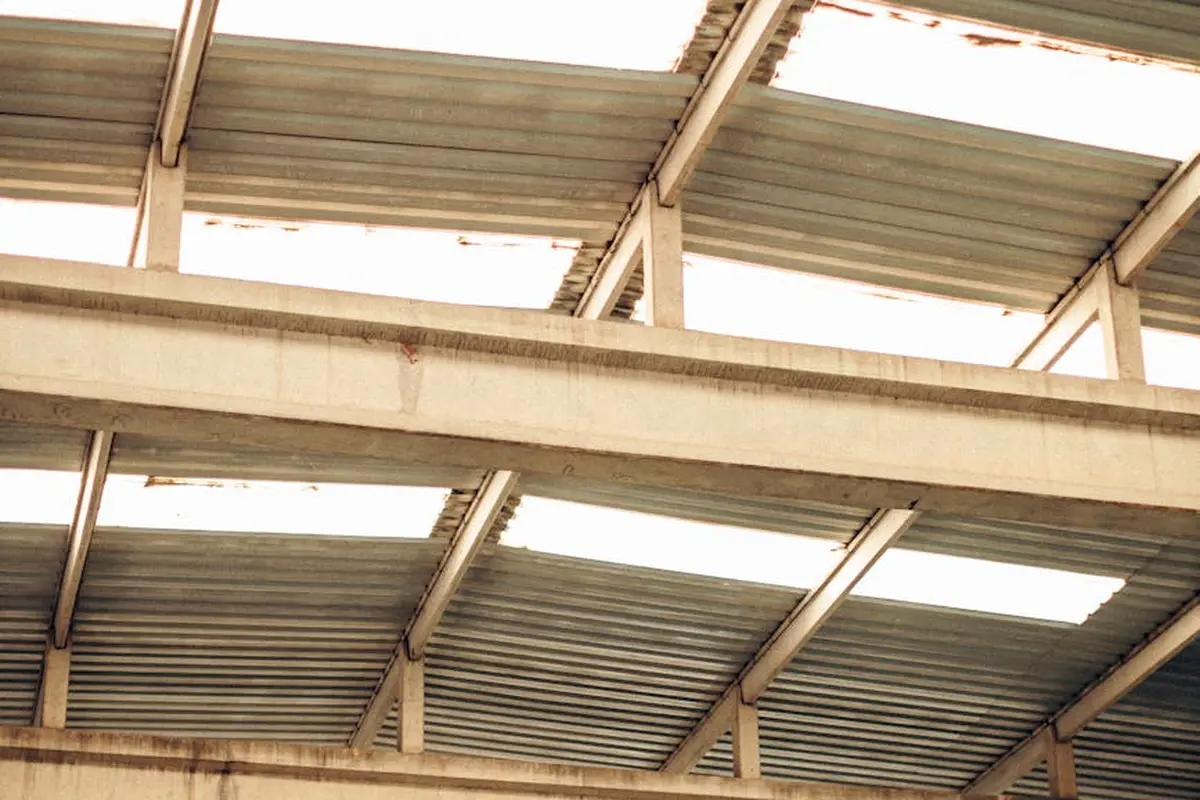 Exposed metal garage roof framing with corrugated panels