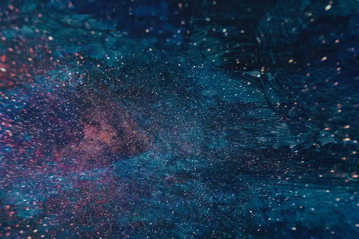 Abstract cosmic nebula with blue and pink hues and scattered stars