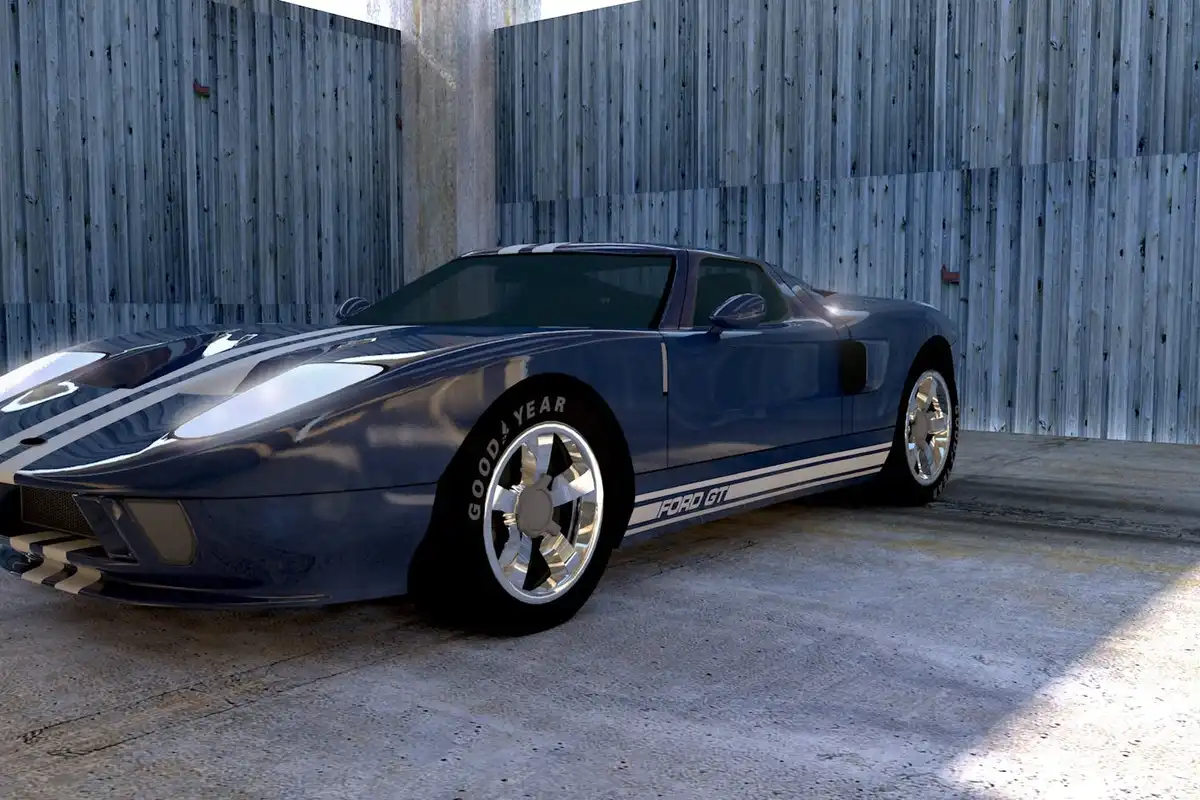 Blue sports car parked in a concrete garage with corrugated metal walls.